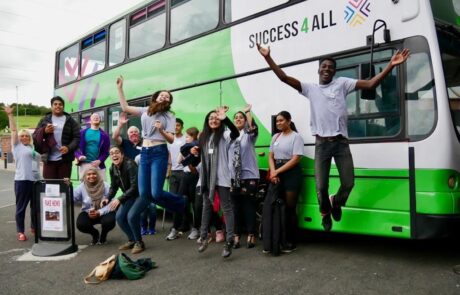 stand4 jumps outside of Success4All's Learning Bus