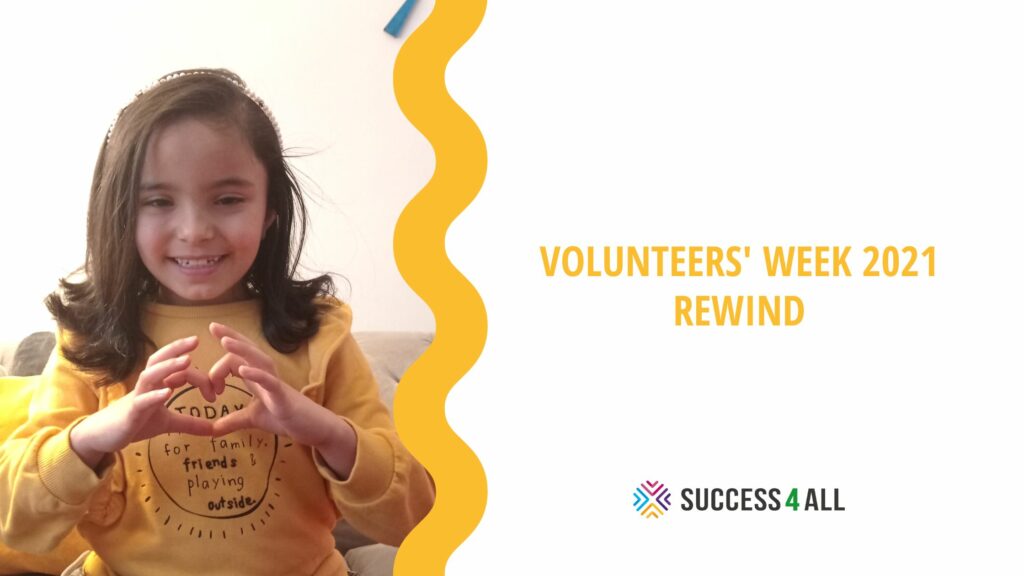 Volunteers' Week 2021 rewind. A little girl wearing a yellow shirt smiles and makes a heart shape.